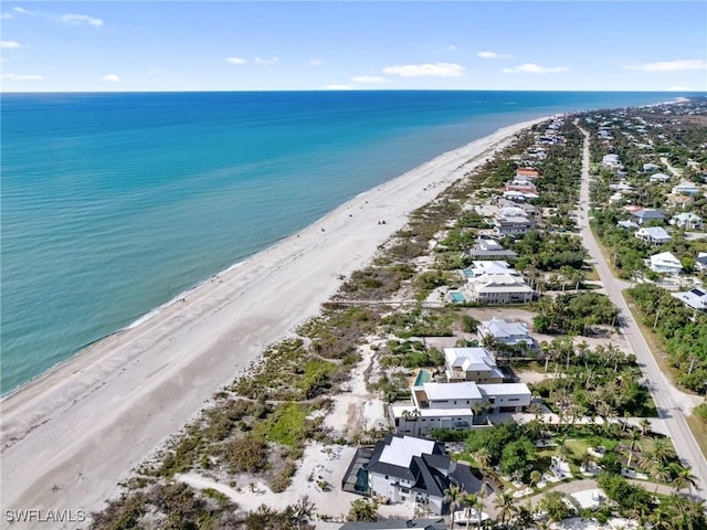 aerial view with a view of the beach and a water view