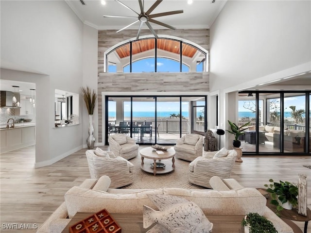 living room featuring wooden ceiling, high vaulted ceiling, sink, ceiling fan, and light wood-type flooring