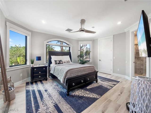 bedroom featuring multiple windows, ceiling fan, and crown molding