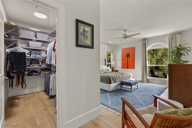 bedroom with baseboards and light wood-style floors