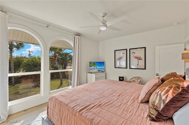 bedroom with ceiling fan and wood finished floors