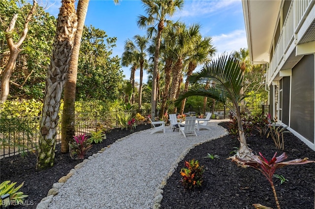 view of yard featuring fence and a patio