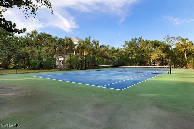 view of tennis court with fence