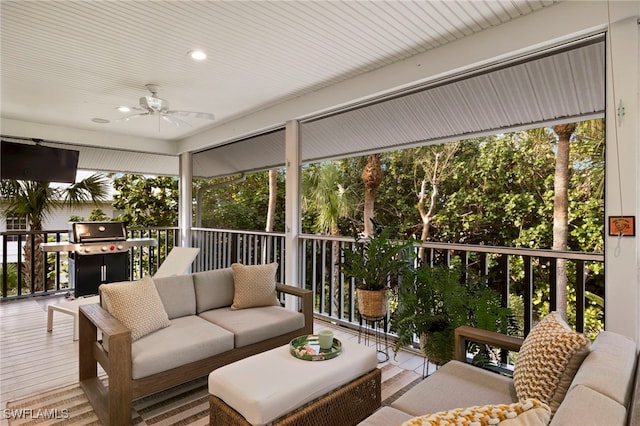 sunroom with a ceiling fan