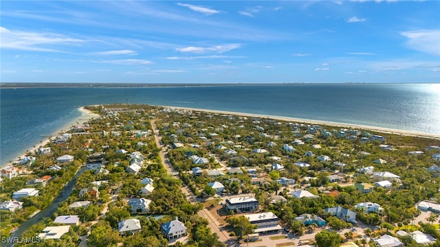 drone / aerial view with a water view and a view of the beach