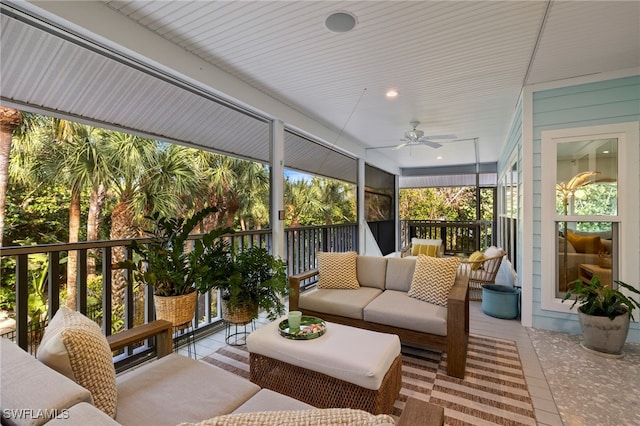 sunroom / solarium featuring ceiling fan