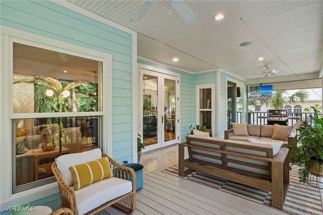 deck featuring french doors, grilling area, a ceiling fan, and an outdoor living space