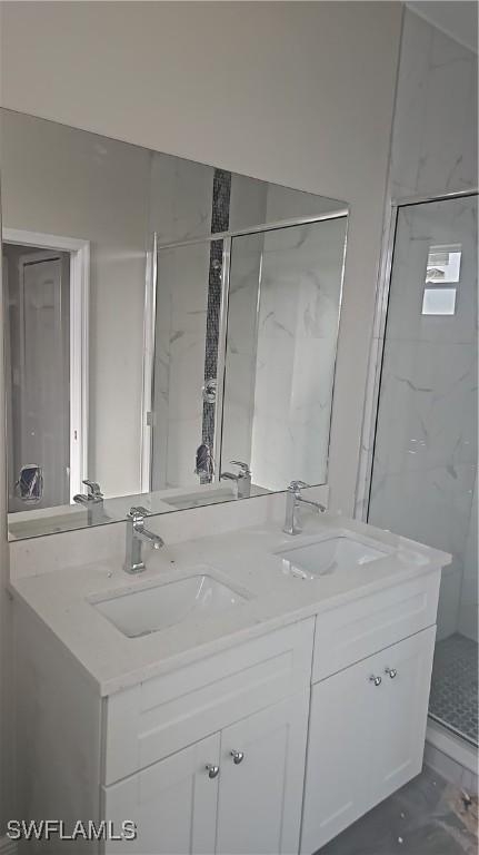 3019 32nd St W, Lehigh Acres, FL 33971 - full bath featuring double vanity and a shower stall