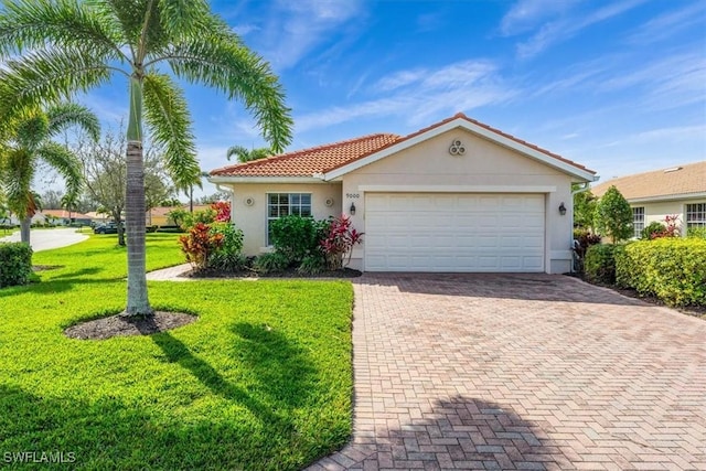 view of front facade featuring a front yard and a garage