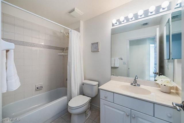 full bathroom featuring tile patterned flooring, shower / bath combination with curtain, vanity, and toilet