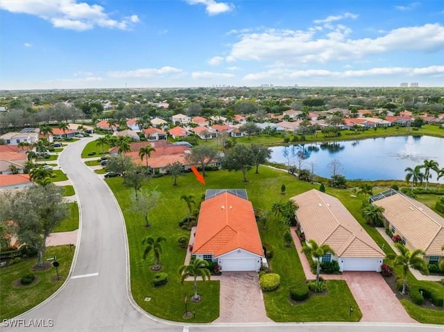 birds eye view of property with a water view