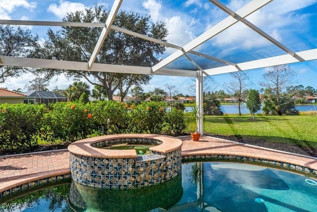 view of swimming pool with a lanai, a water view, an in ground hot tub, and a lawn