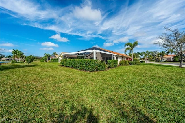 view of yard featuring a lanai