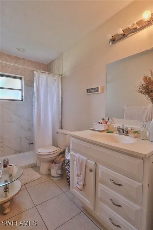 bathroom featuring tile patterned flooring, vanity, toilet, and a shower with shower curtain