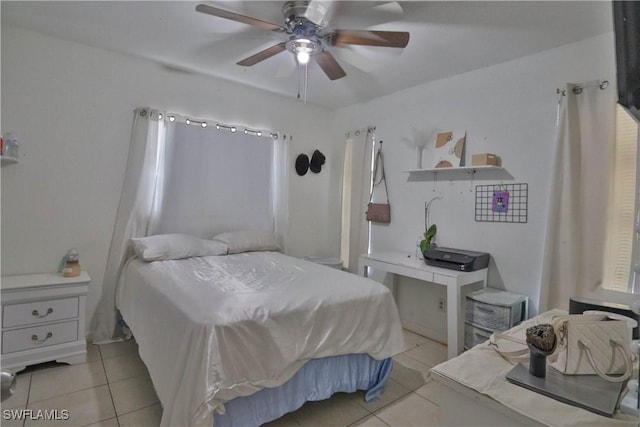 bedroom with ceiling fan and light tile patterned floors