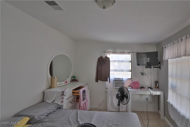 bedroom with light tile patterned flooring