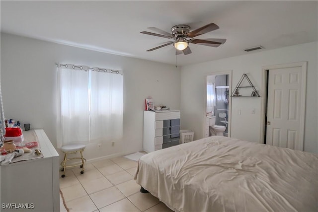 bedroom featuring ensuite bath, ceiling fan, and light tile patterned flooring