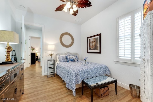 bedroom featuring ceiling fan and light hardwood / wood-style floors