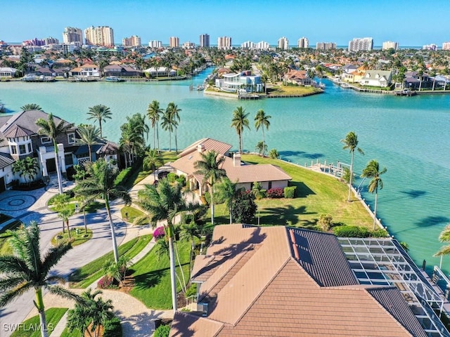 birds eye view of property with a water view