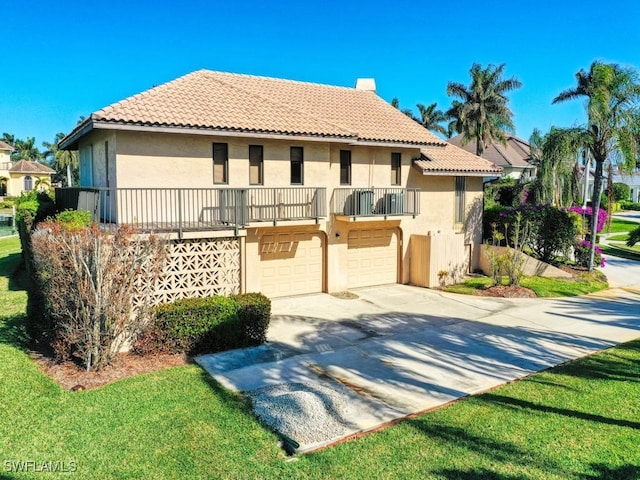 mediterranean / spanish house with a garage