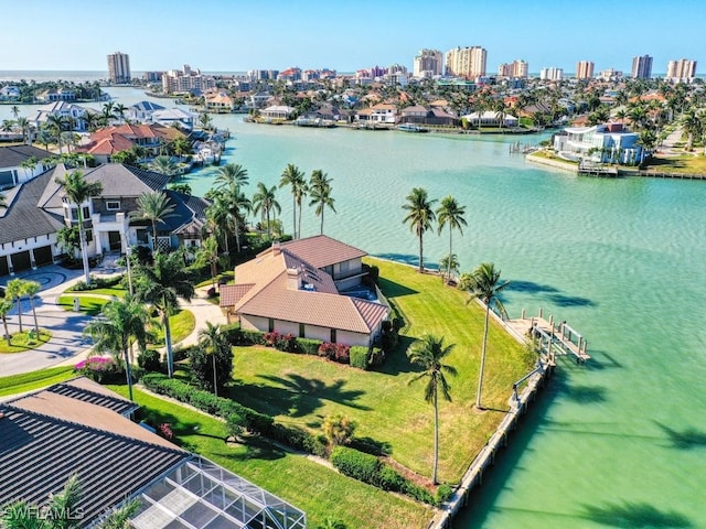 birds eye view of property with a water view