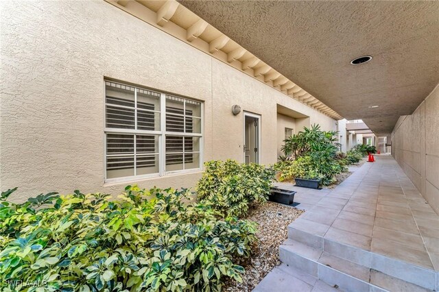 entrance to property with a patio area