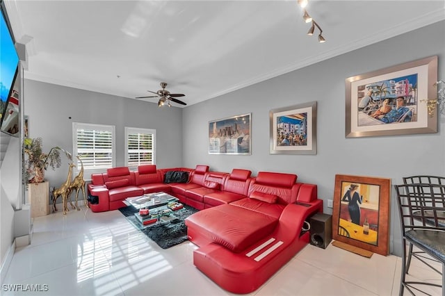 tiled living room with ceiling fan, rail lighting, and ornamental molding