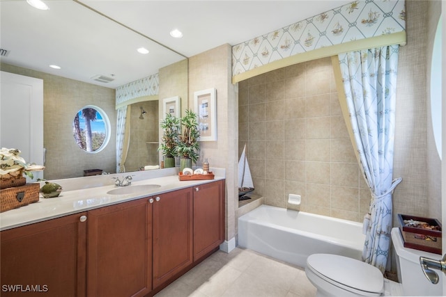 full bathroom featuring tile patterned flooring, vanity, shower / bath combo, and toilet