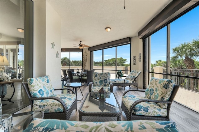 sunroom with ceiling fan