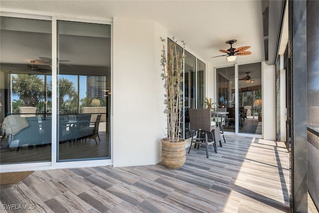 exterior space featuring ceiling fan