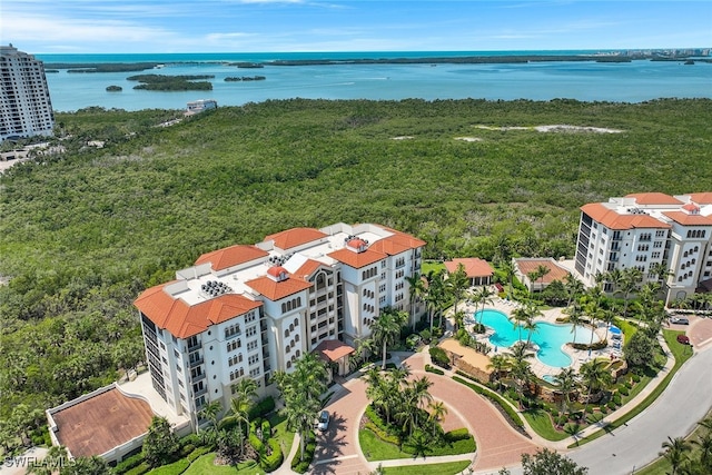 birds eye view of property with a water view