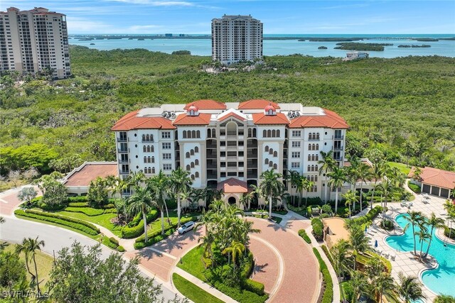 birds eye view of property with a water view