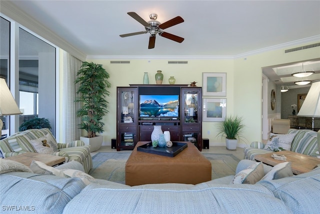 living room featuring crown molding, light colored carpet, and ceiling fan