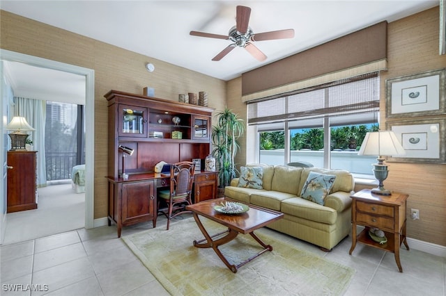 tiled living room with ceiling fan