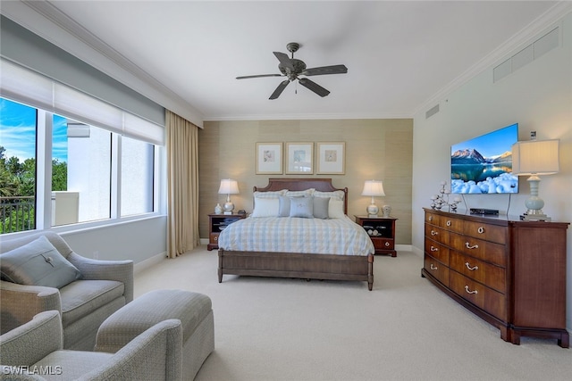 bedroom with ceiling fan, ornamental molding, and light carpet