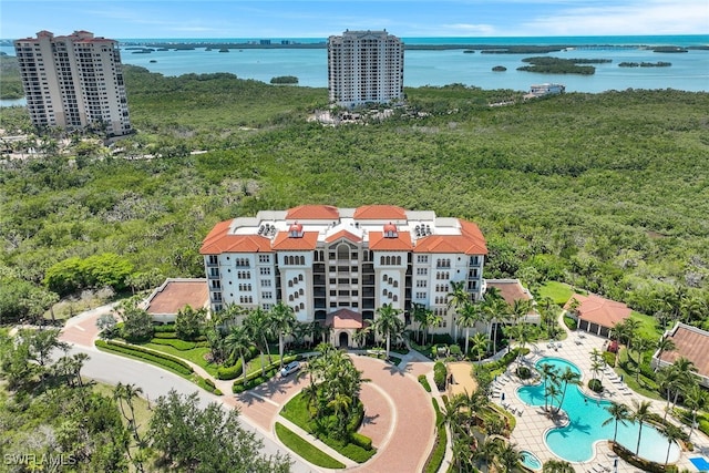 birds eye view of property with a water view