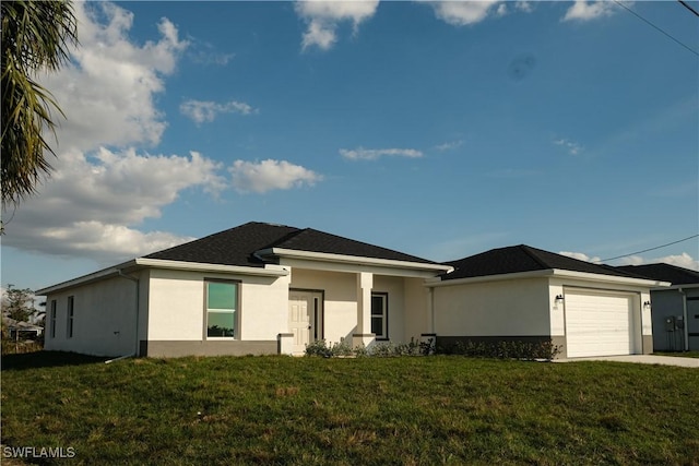 prairie-style home with a garage and a front yard