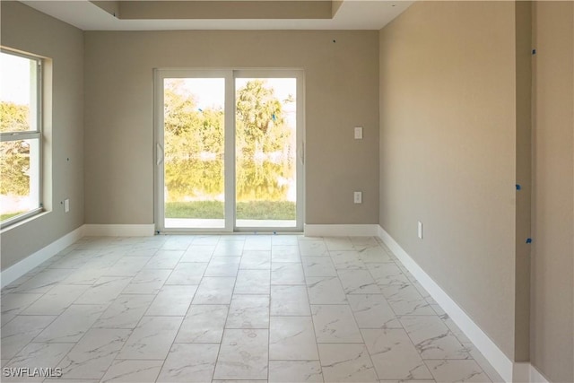 unfurnished room featuring a healthy amount of sunlight