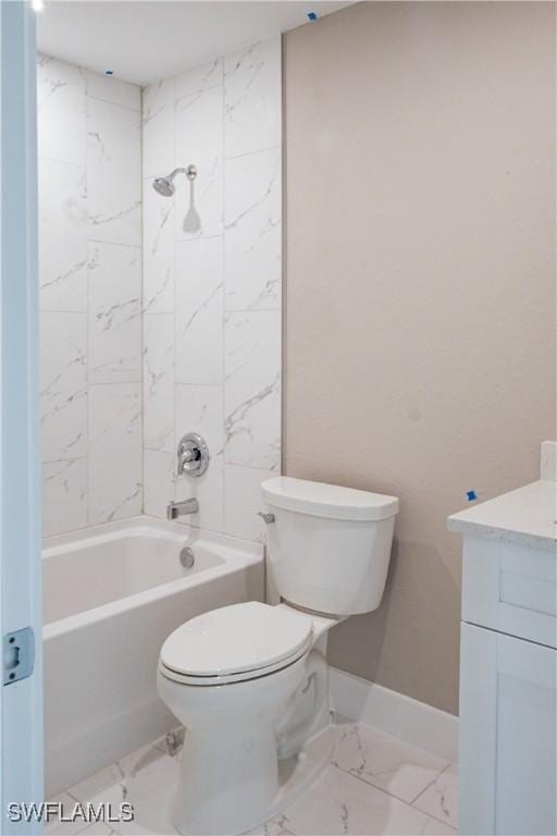 full bathroom featuring tiled shower / bath, vanity, and toilet