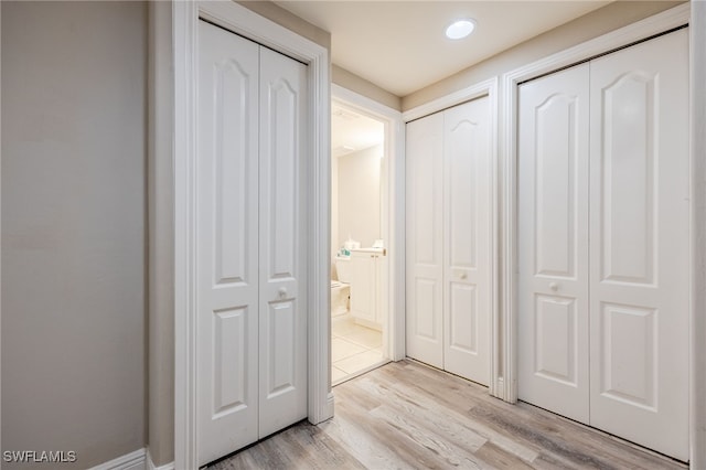 corridor featuring light wood-type flooring