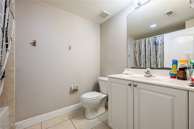 bathroom with tile patterned floors, vanity, and toilet