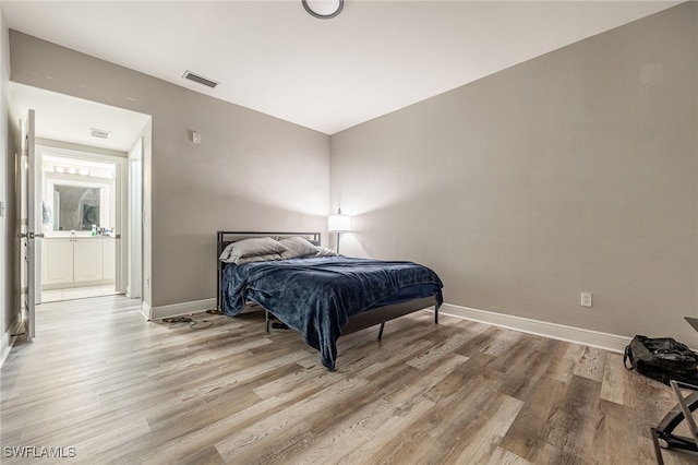 bedroom featuring wood-type flooring