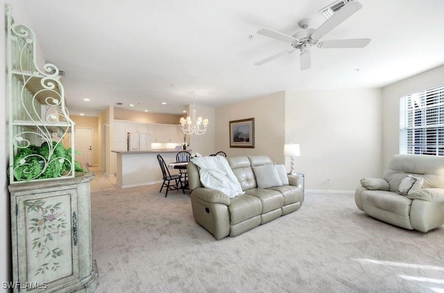 living area with visible vents, light carpet, ceiling fan with notable chandelier, recessed lighting, and baseboards