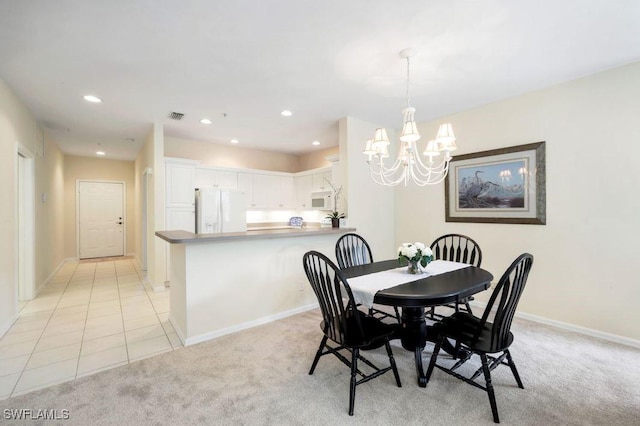 dining space featuring baseboards, visible vents, recessed lighting, light carpet, and a notable chandelier