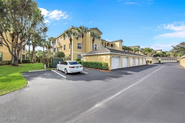 view of road featuring community garages and a residential view