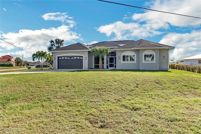 view of front of house featuring a garage and a front yard