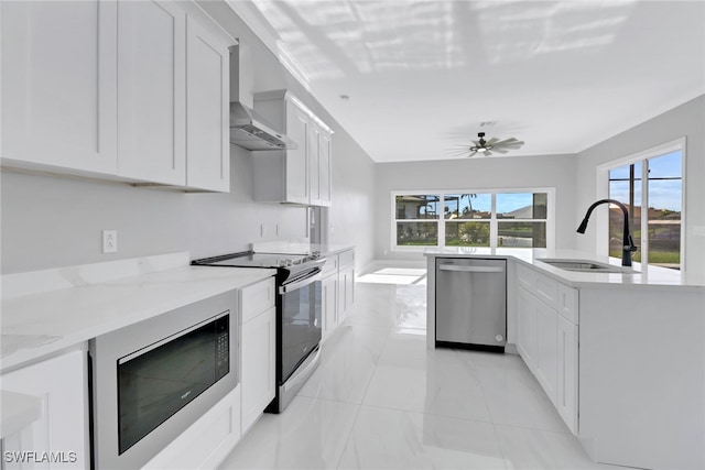 kitchen with built in microwave, white cabinetry, sink, stainless steel dishwasher, and range with electric stovetop