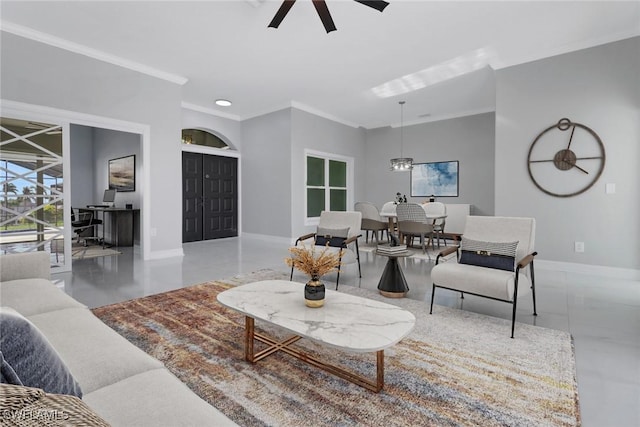 living room featuring ceiling fan and ornamental molding