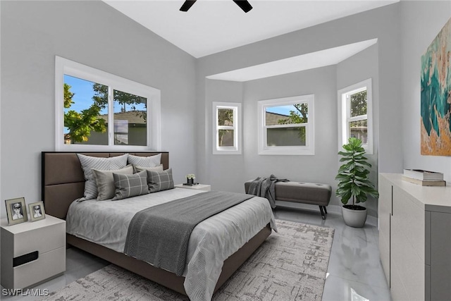 bedroom with multiple windows and ceiling fan