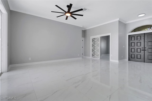 interior space with ceiling fan and crown molding